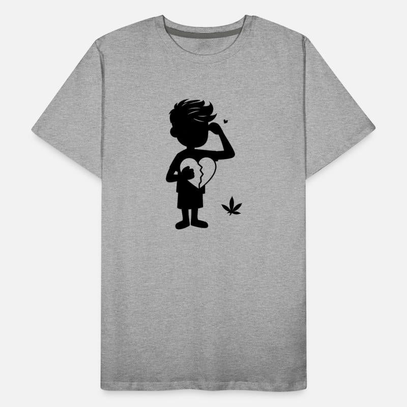 A silhouette of a boy holding a broken heart